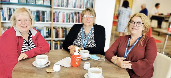 A group of women sitting at a table having coffee in Cramlington Hub