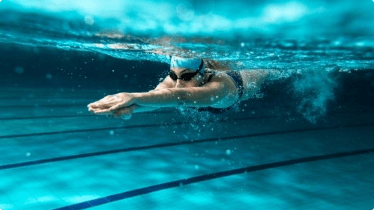 A person swimming in a pool