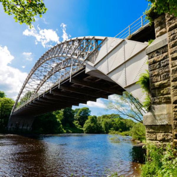 A large metal bridge over a river