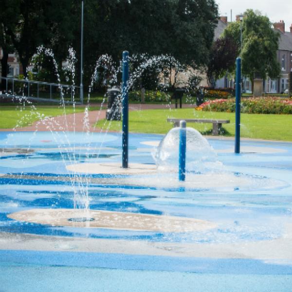 The water play area, various blue columns spray water out.